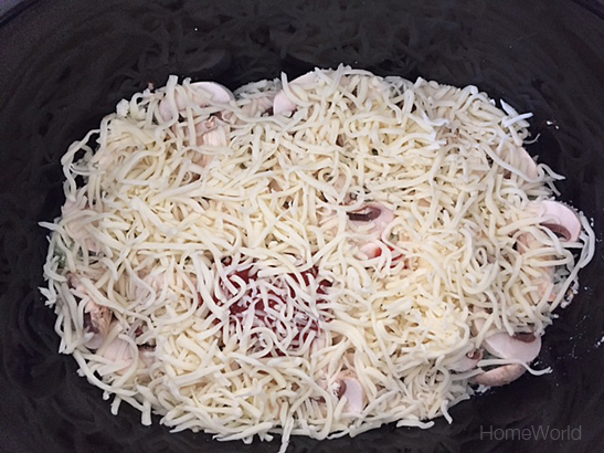 Add a generous portion of mozzarella cheese.
